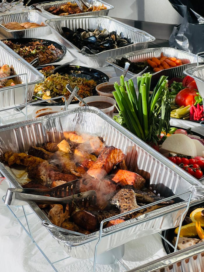 about-img A spread of diverse and delicious dishes at a catered buffet showcasing a variety of cuisines.